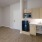 a kitchen with wooden cabinets