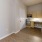 a room with a wood floor and a white door