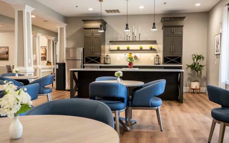 a lounge with seating and kitchen