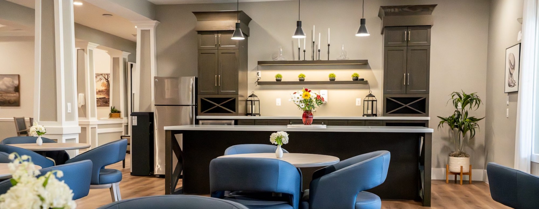 a lounge with seating and kitchen