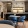 a lounge with seating and kitchen
