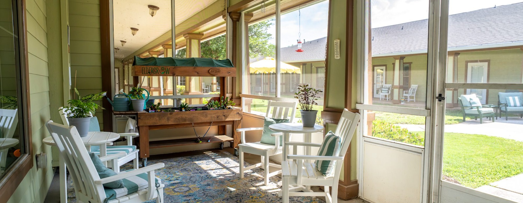 sunroom with seating and small garden