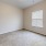 a room with a carpet and a window