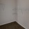 a white wall with a metal bar